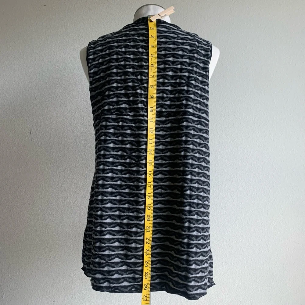 Apropos knit vest, black, gray geometrical jersey print adds warmth and layers M